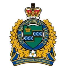 Niagara Regional Police Service emblem featuring a crown atop a circular badge with the words "Unity Responsibility Loyalty."