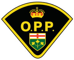 Ontario Provincial Police (O.P.P.) logo featuring a black and yellow shield. The top of the shield has a gold and red crown. Below the crown, the letters "O.P.P." are displayed in yellow. Underneath, there is a green and gold shield with a red cross and three gold maple leaves.